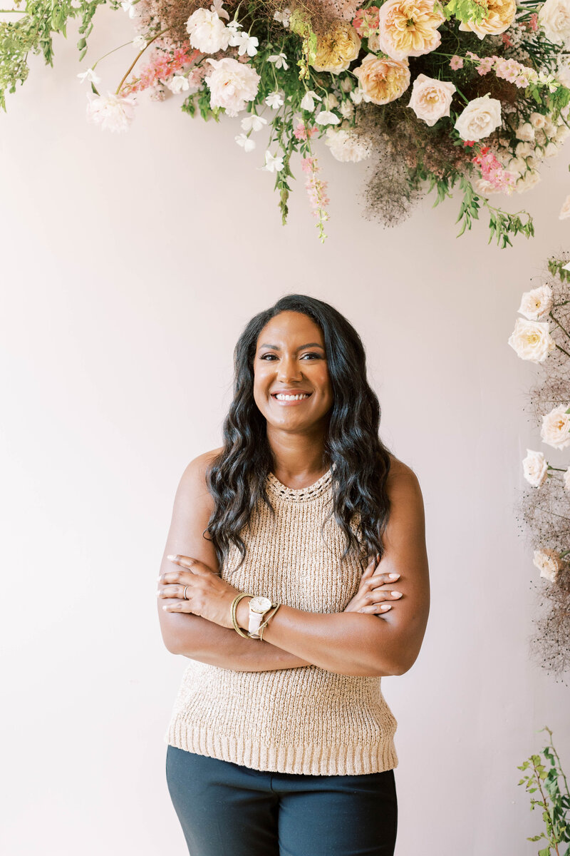 amber smiling with her arms crossed