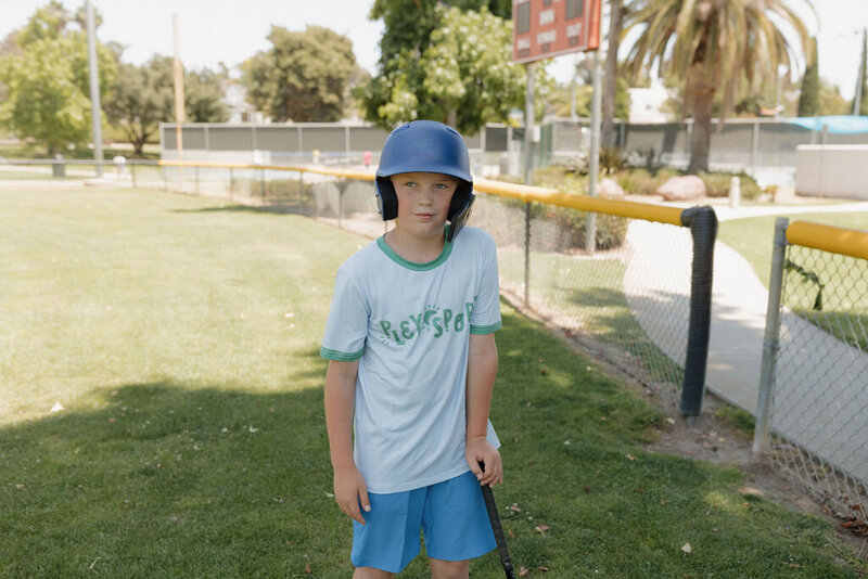 kid playing baseball at San Marcos, CA camp
