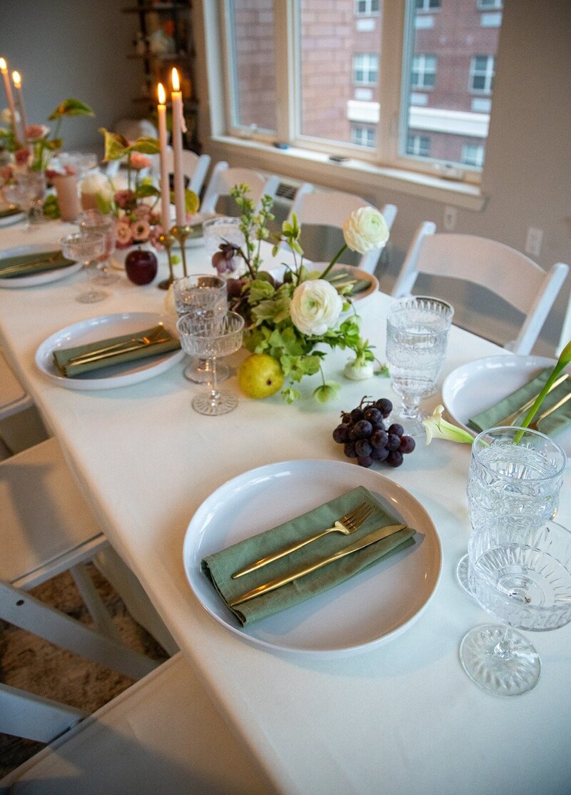 Chic indoor tablescape with crystal glassware, taper candles, and fresh fruit and floral centerpieces, styled by Yours Truly, a wedding planner and designer in New Jersey