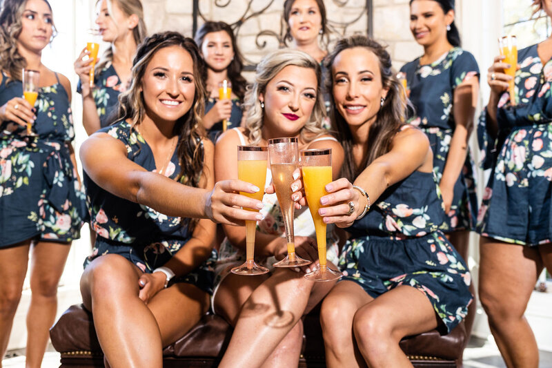 Bridesmaids hold mimosas while getting ready, Maryland Wedding Photographer