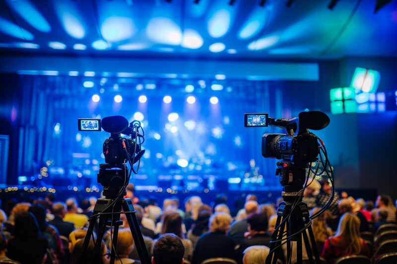 Video cameras recording a corporate event