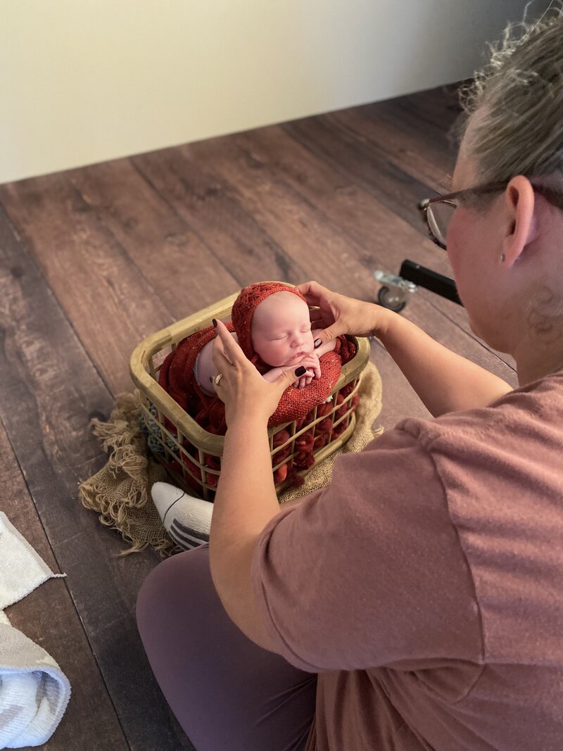 A peek behind the curtain—studio styling and safety in the hands of an experienced newborn photographer.