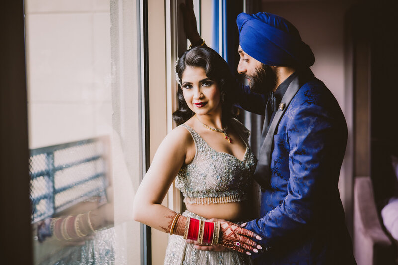 Sikh bride and groom inside the Hilton penn's landing hotel in philadelphia before their wedding reception at rivers casino