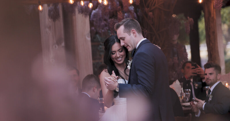 This wedding film frame grab from Films by Brian, a Williamsburg, VA-based destination wedding videographer, shows a beautiful bride dancing with her groom at a winery wedding in California.