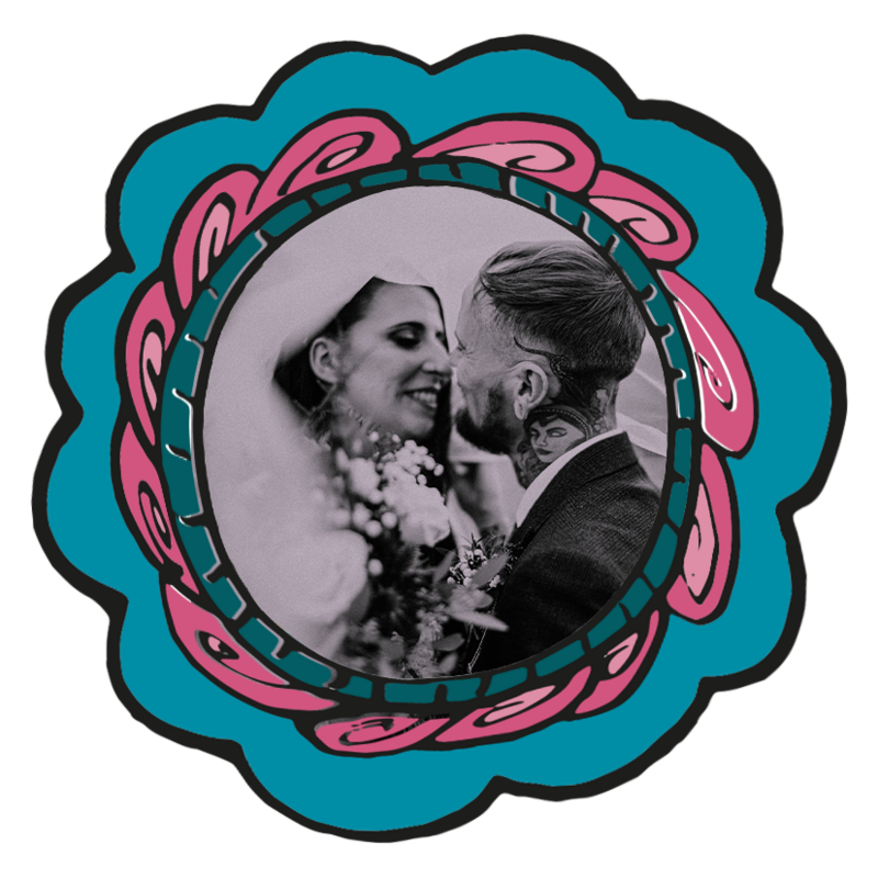 Black and white wedding photo, of couple about to kiss, smiling under a veil
