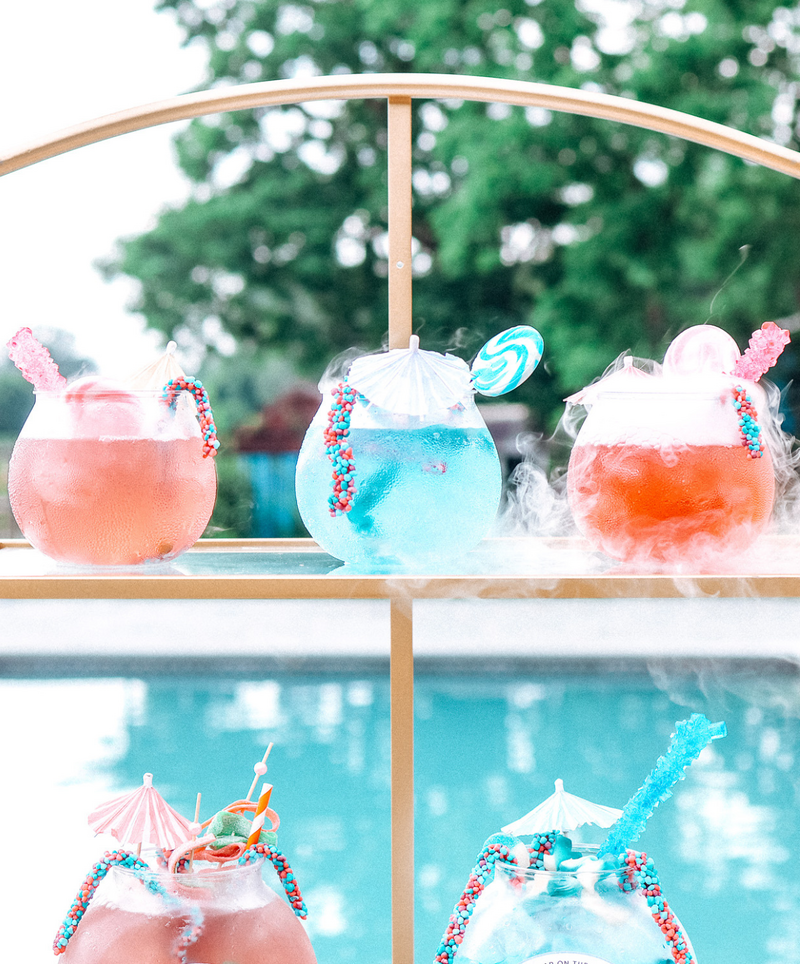 Display of bright candy fishbowls by mobile bar in NJ