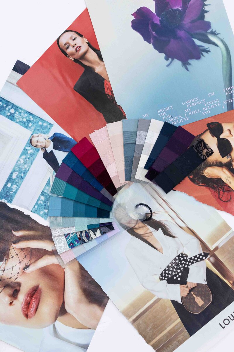 Luxury brand mood board featuring fan of color swatches layered over fashion editorial images showcasing strategic color story development