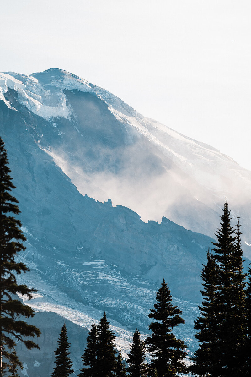 A closeup view of a cloud settling in between the ridges of Mt Rainier