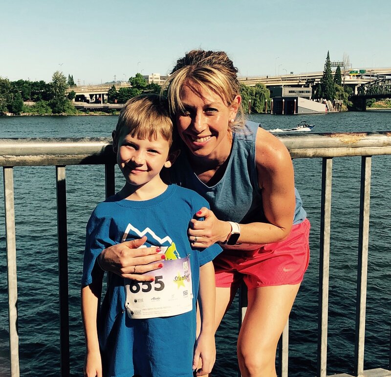 Brynn Smith and son standing together after race