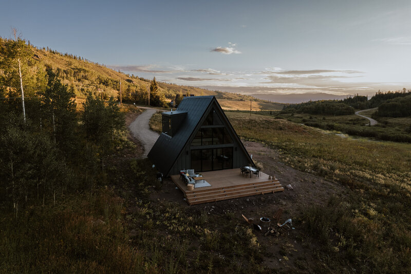 Modern A-frame cabin in golden-hour light, captured by Breckenridge Colorado branding photographers for creative content.