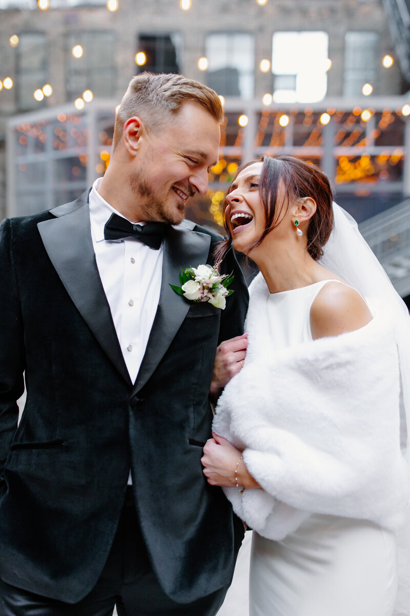 Bride and groom laugh