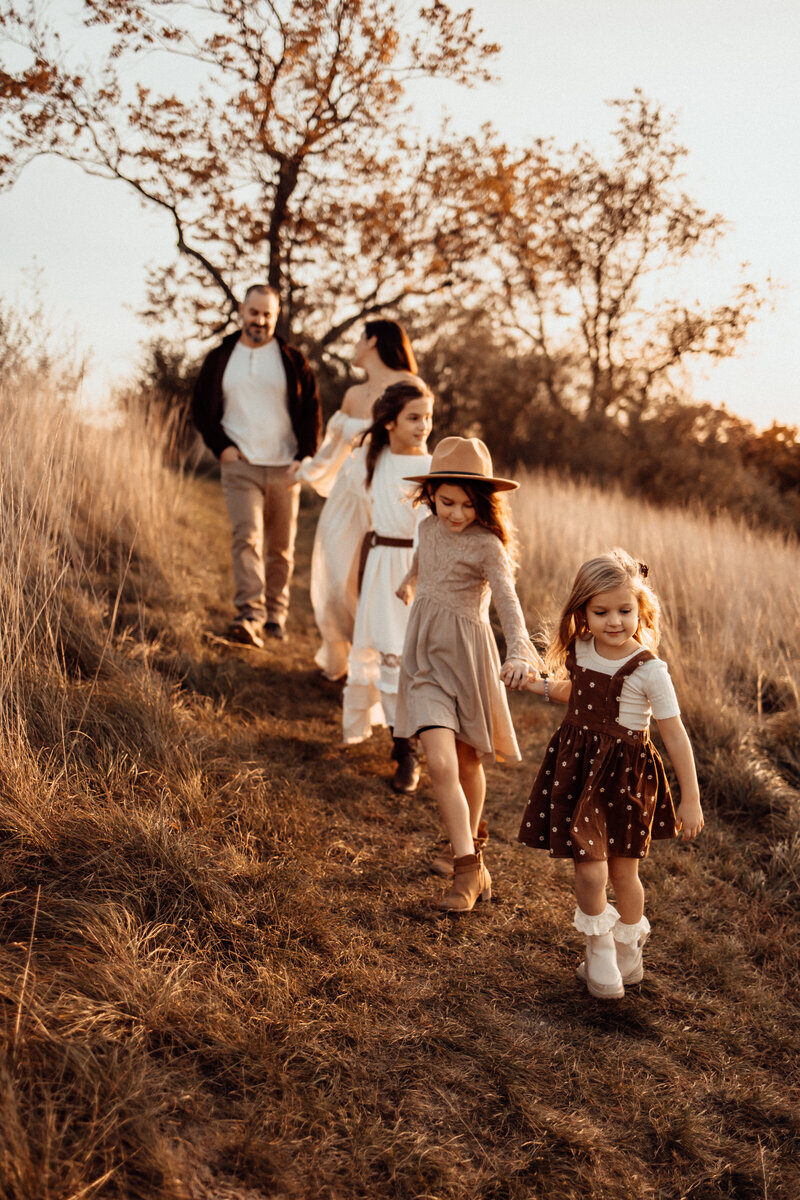 family walking during photos taken in fall