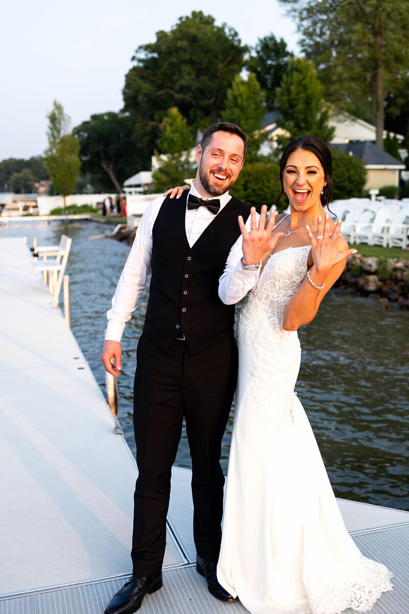 Newlyweds showing off their rings during their Michigan wedding package.