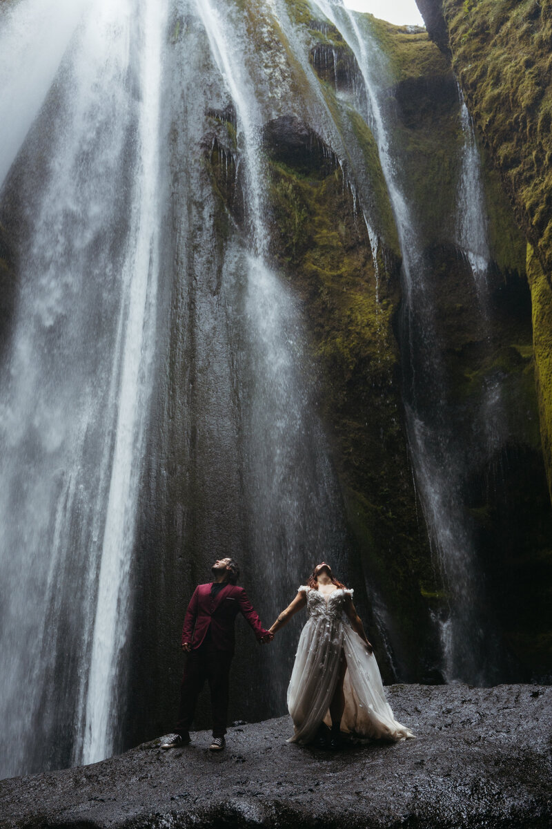 Couple waterfall Iceland elopement