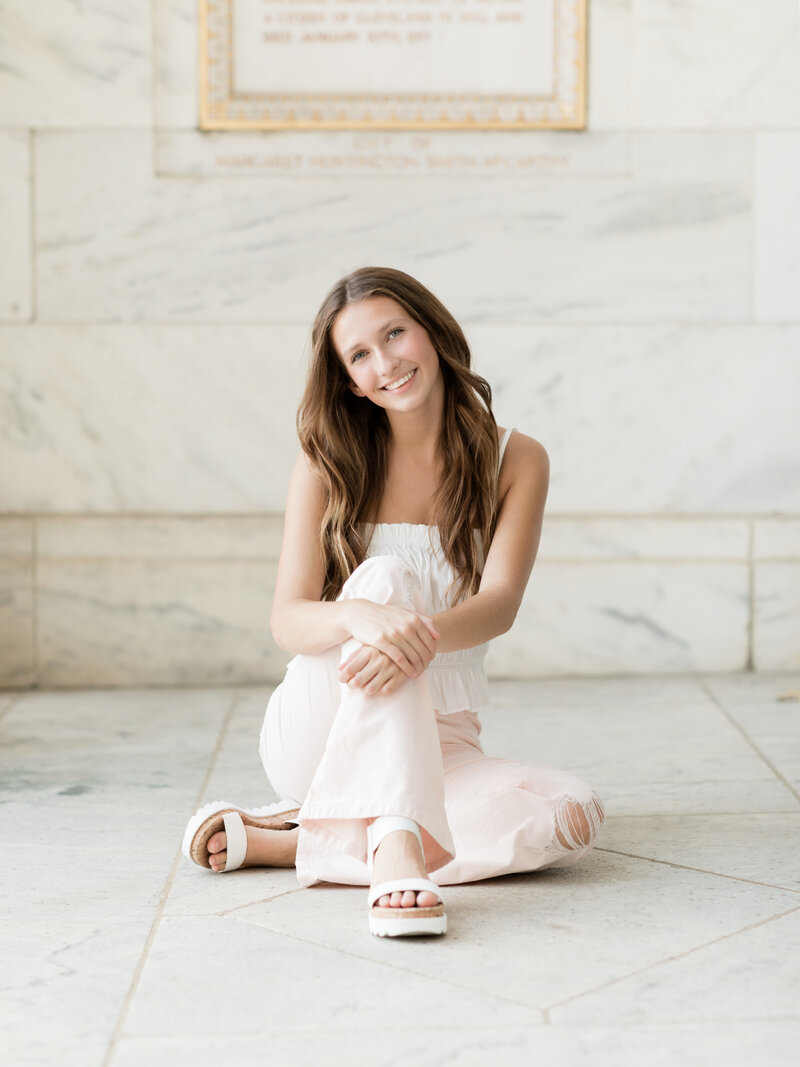 high school senior girl sitting at Cleveland art Museum for portraits Cleveland family photographer