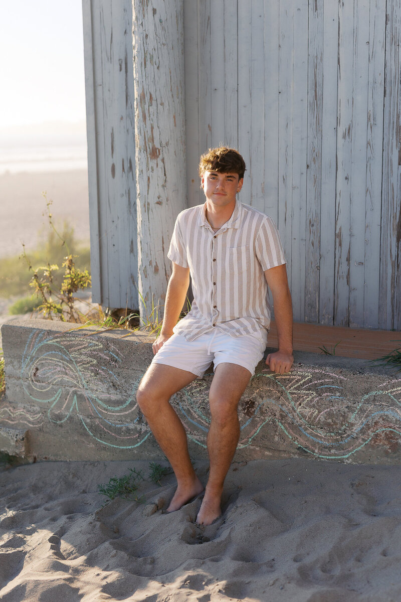 High school senior portrait beach light sunset