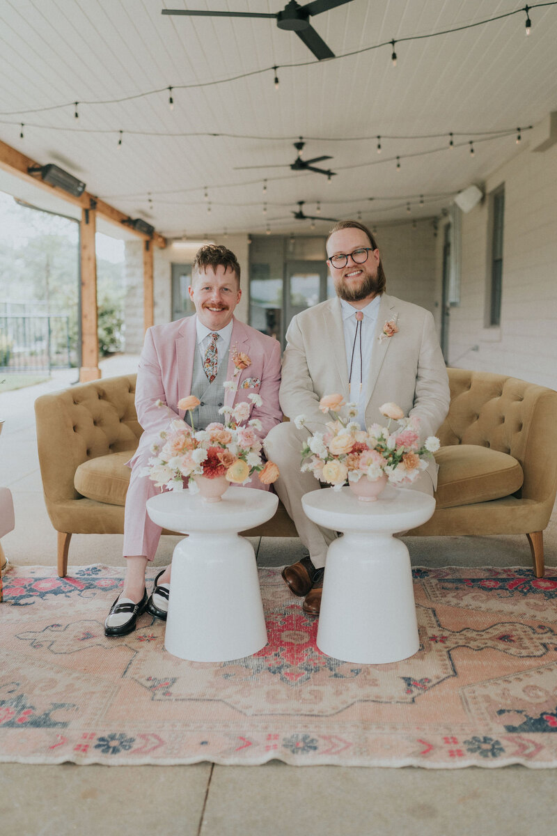 A couple exiting their wedding ceremony in celebration