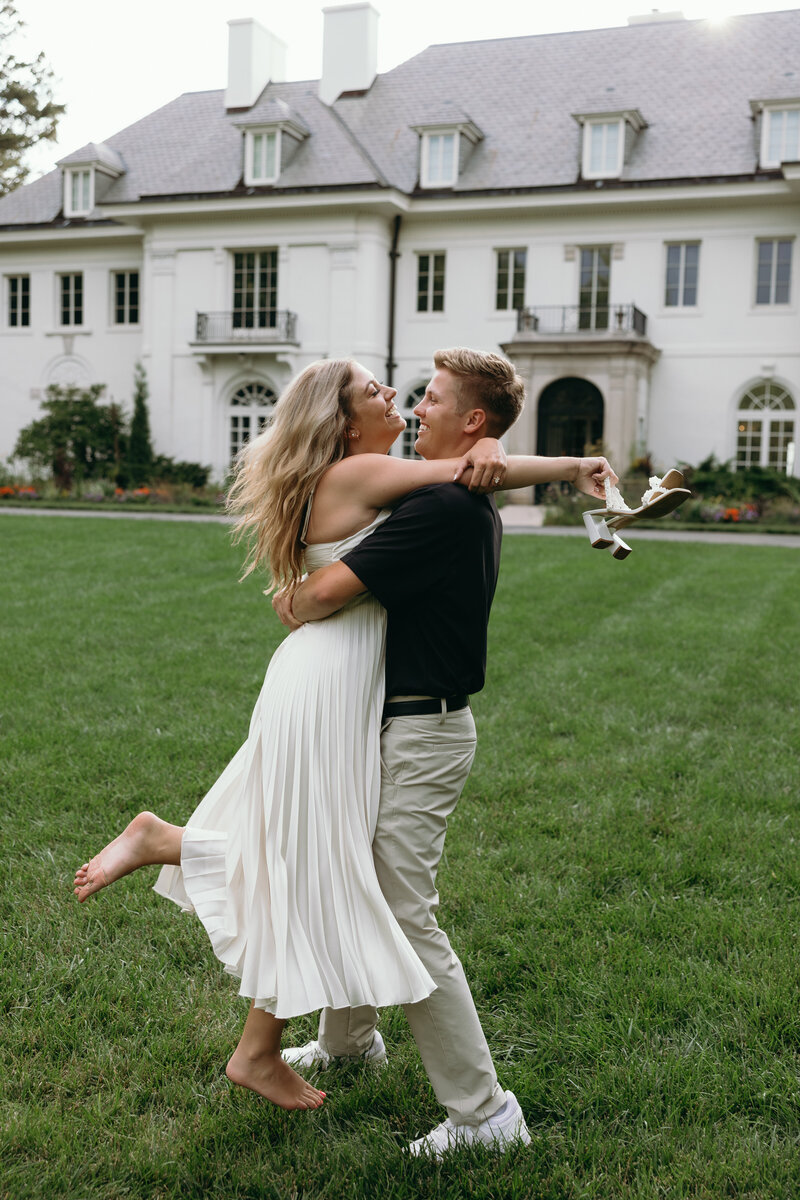 Bride and groom walking hand-in-hand, captured by Ryann B Photography, a wedding photographer in Indianapolis and beyond.