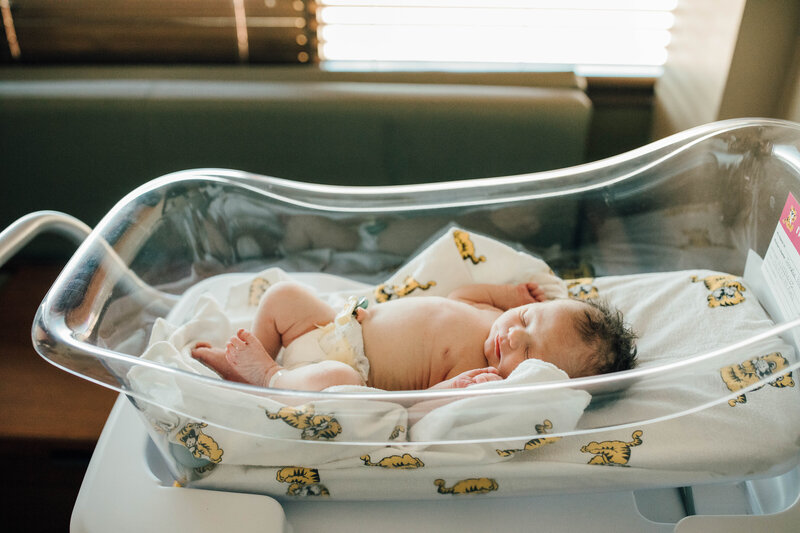 Fresh48 photos of newborn baby in hospital bassinet