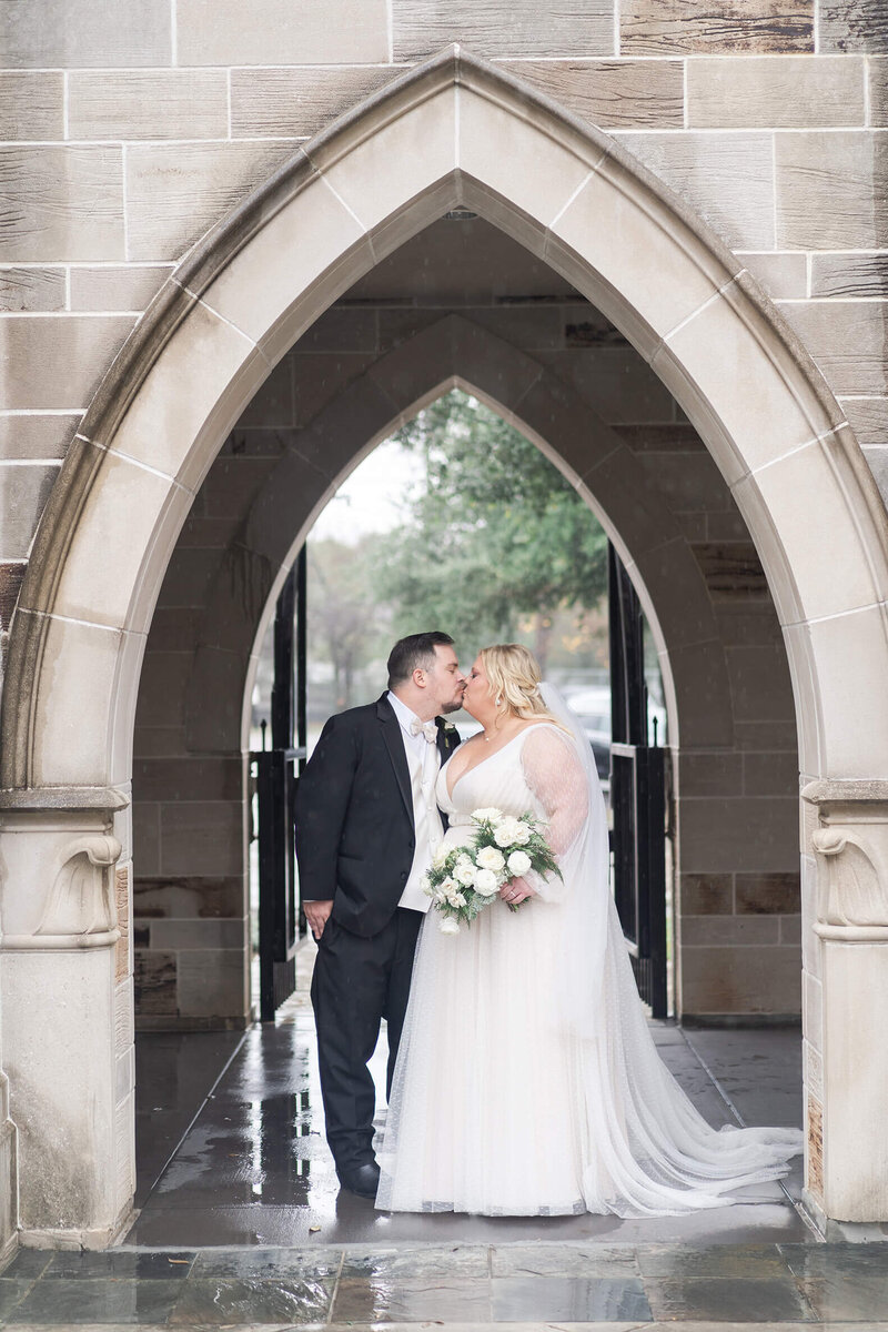 Houston's best wedding photographer Swish & Click Photography captures a wedding kiss at Holy Rosary Church