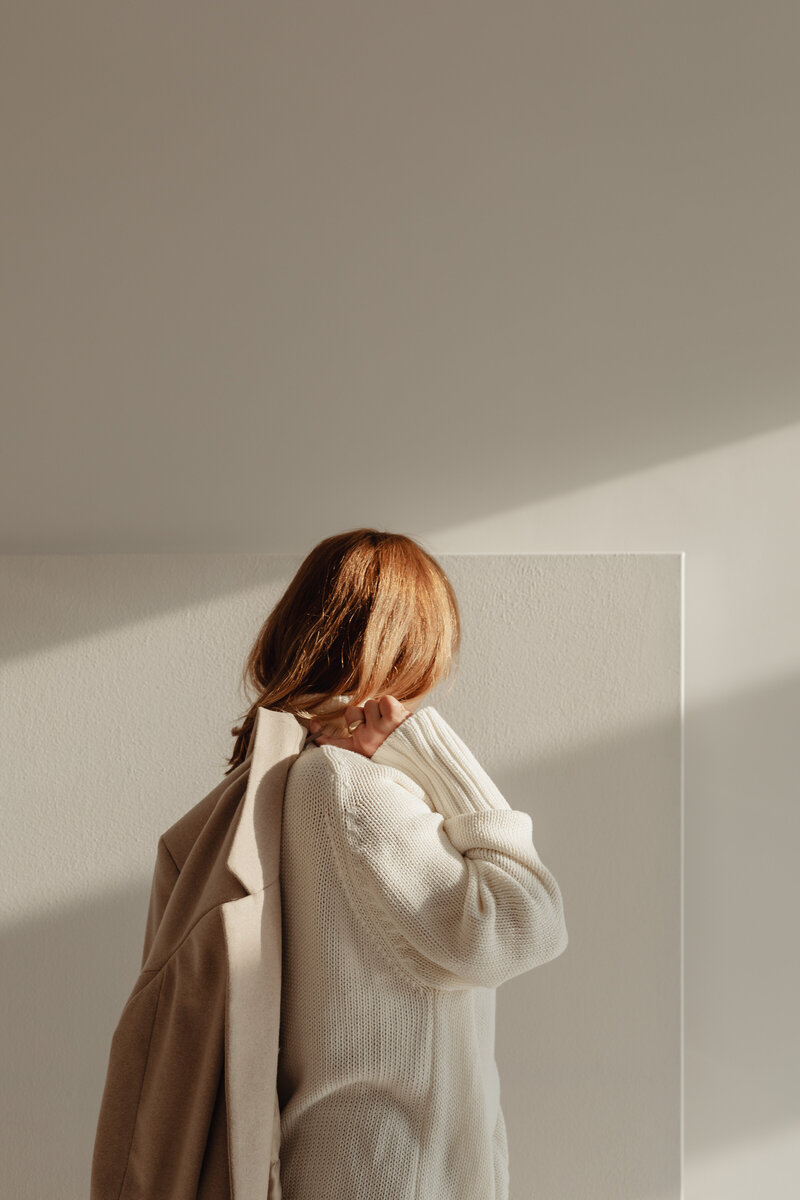 kaboompics_woman-in-white-sweater-beige-wool-jacket-29434