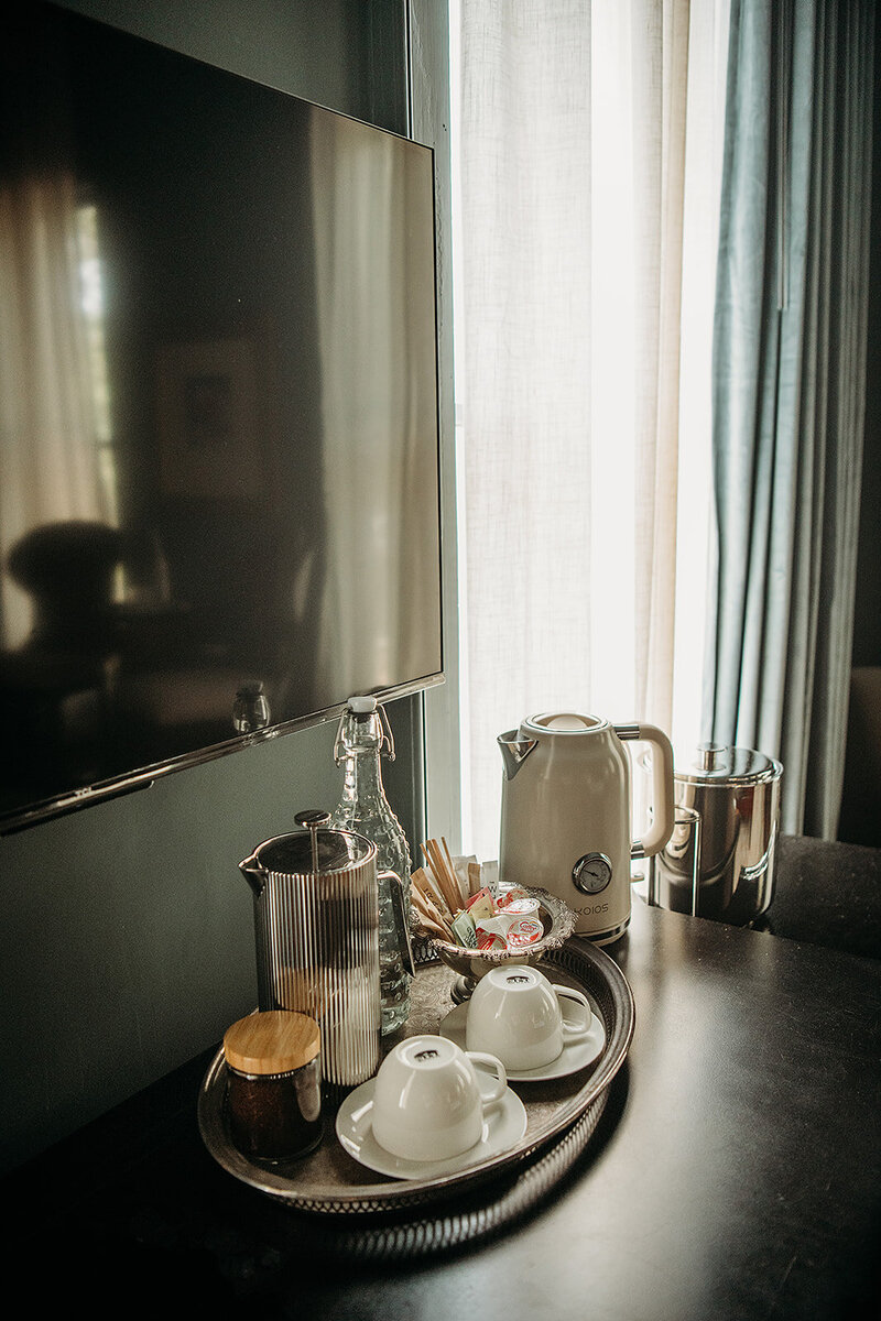 Each room has a tea kettle, French press and fridge.