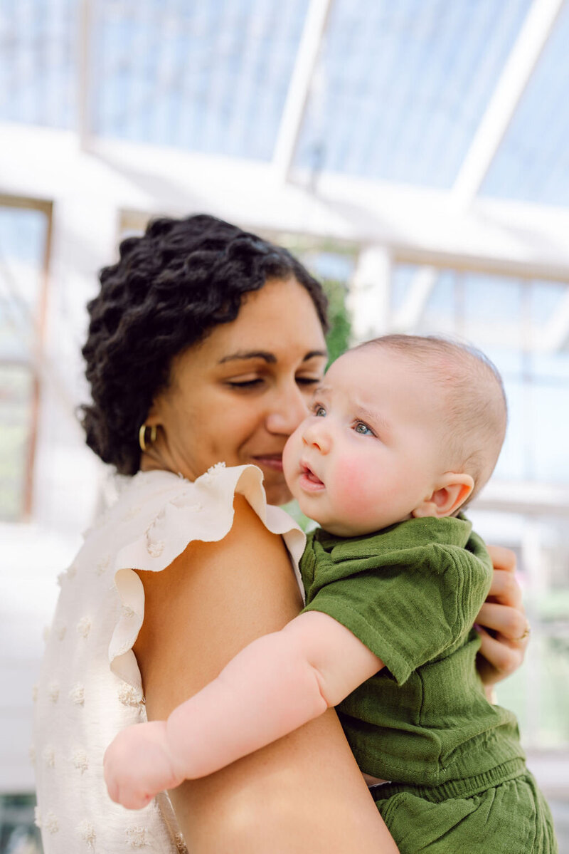 13-Lifestyle-Family-Greenhouse-Portrait-Mother-Holding-Baby