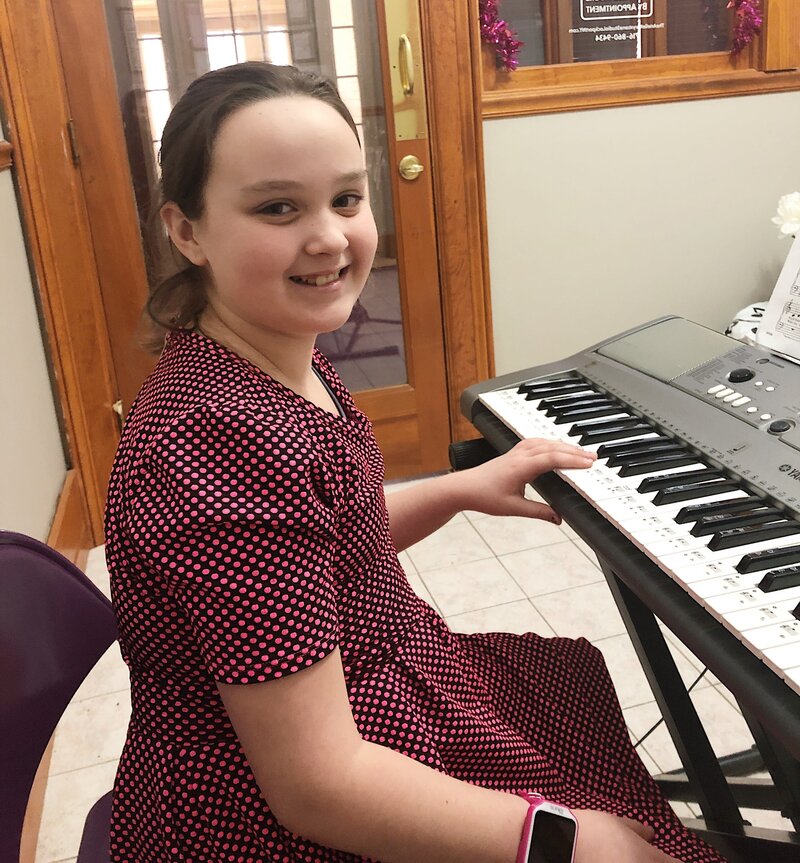 girl playing piano