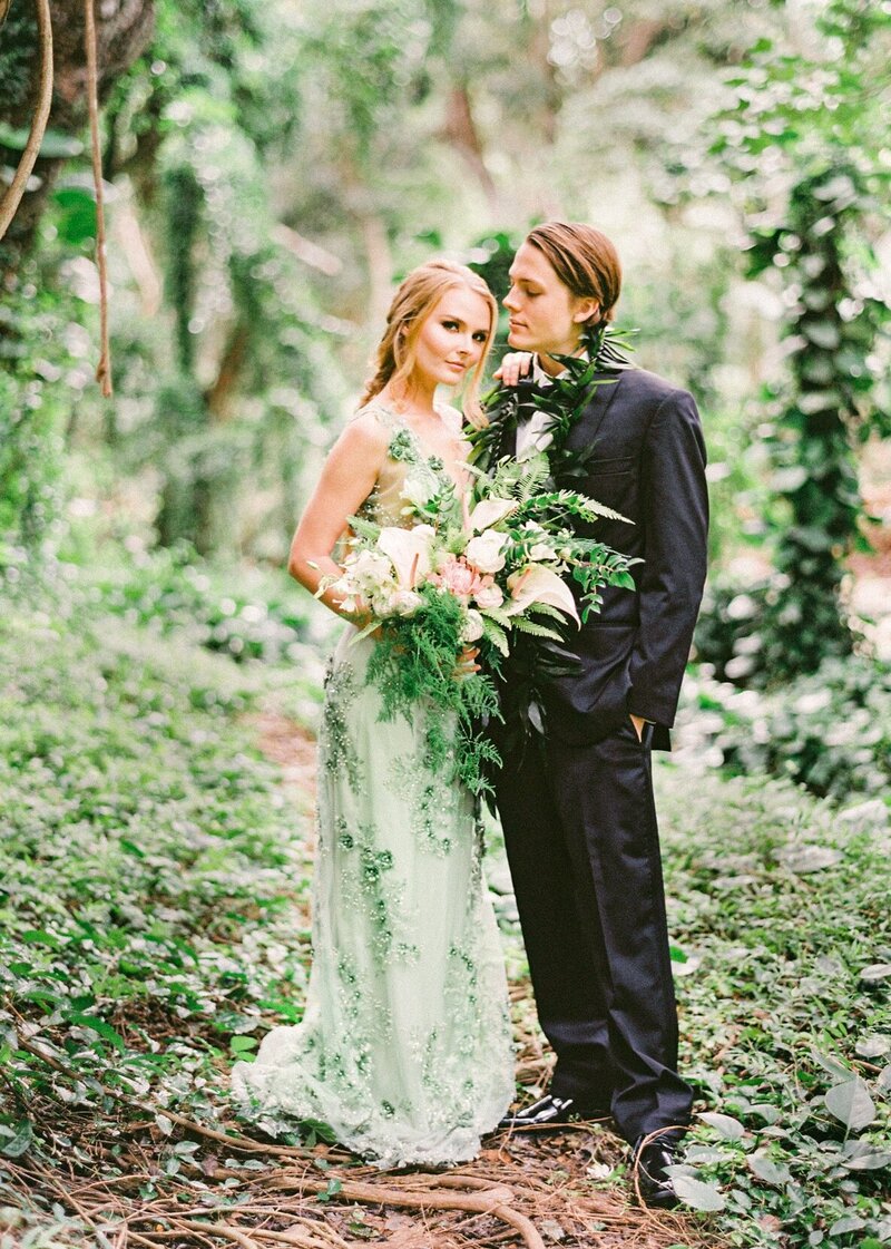 Honolua rainforest elopement couple with green wedding dress