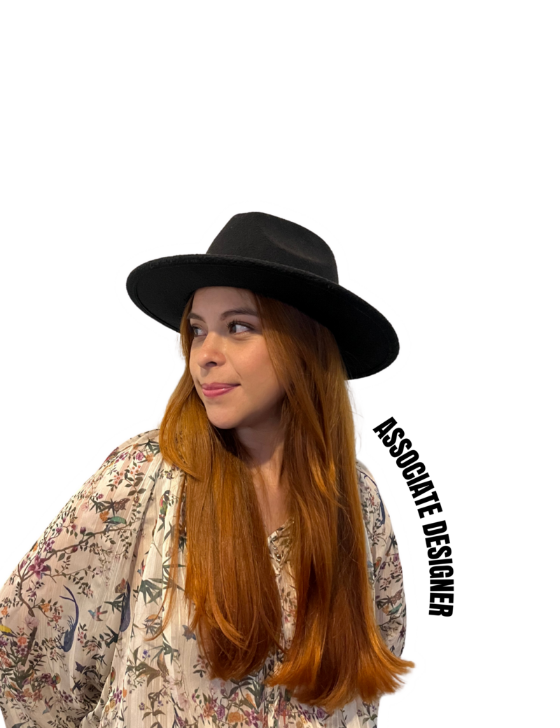 Professional Latina-owned creative studio associate designer wearing a hat and stylish blouse, representing the power and creativity of Latina-owned businesses in the design industry.
