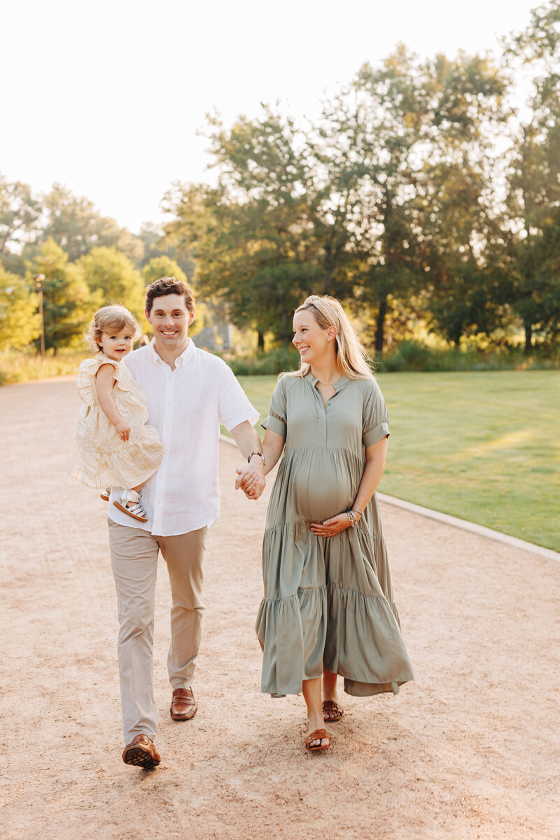 family with their dog and newborn baby taken by a houston newborn photographer