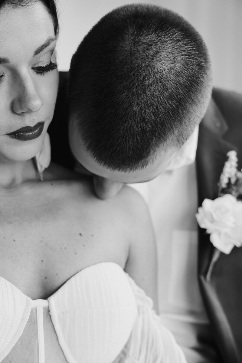 man kissing shoulder