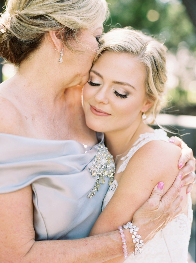 Bride and mother embrace