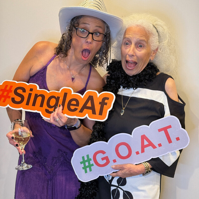 two woman taking a funny photo