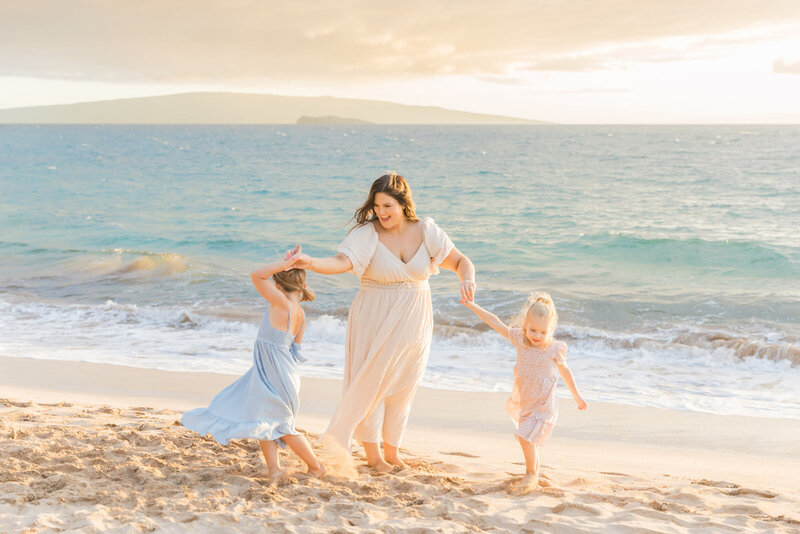 Maui family portraits playing in the sand