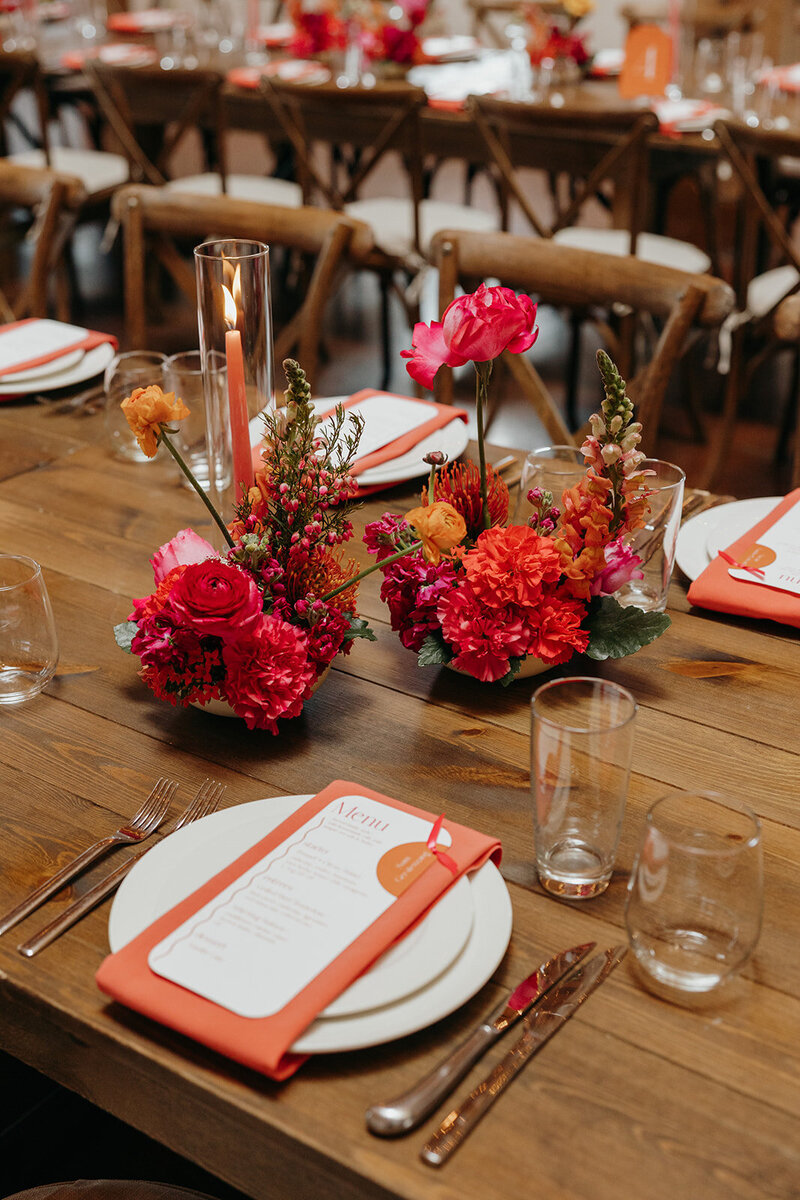 Vibrant modern wedding flowers in shades of pink, red, and orange
