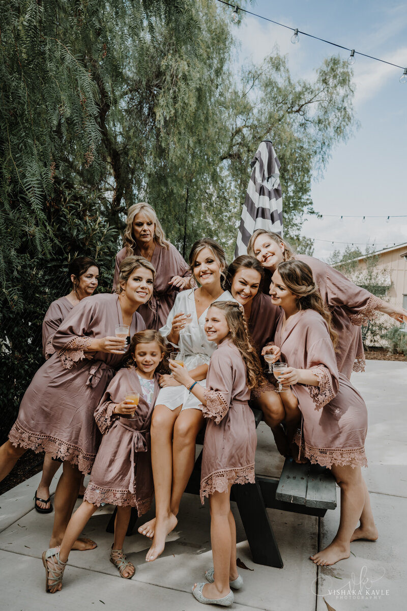 bride surrounded by her bridesmaids