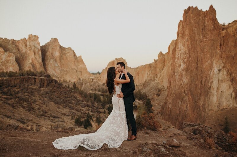 Couple Embracing After Private Sunrise Vow Reading at Smith Rock - Sarah & Daniel | Lakeside Sun River Resort Oregon Wedding