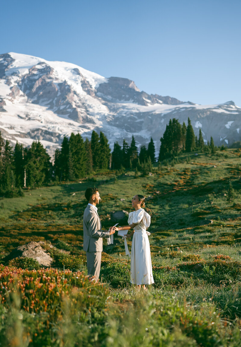 A couple shares private vows on their Mt. Rainier elopement day.