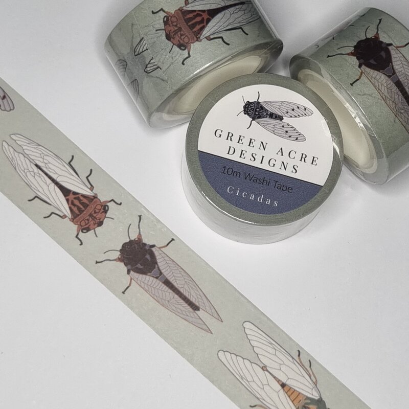 Celebrate the sounds and spirit of summer with this “Cicadas” washi tape by Green Acre Designs. Featuring a beautifully illustrated series of native cicadas on a soft sage green background, this 10-metre roll adds a uniquely Australian, nature-inspired touch to your journaling, scrapbooking, and gift wrapping. Designed for those who love quirky stationery with artistic flair, it brings together a love of insects, illustration, and thoughtful design in one charming tape.