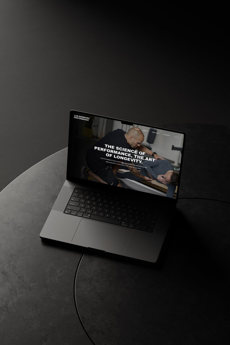 Showit website design for Luis Bermudez Performance displayed on laptop.