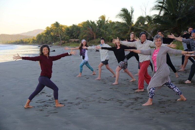 Beach yoga class led by instructor Alison Scola during yoga training in Costa Rica