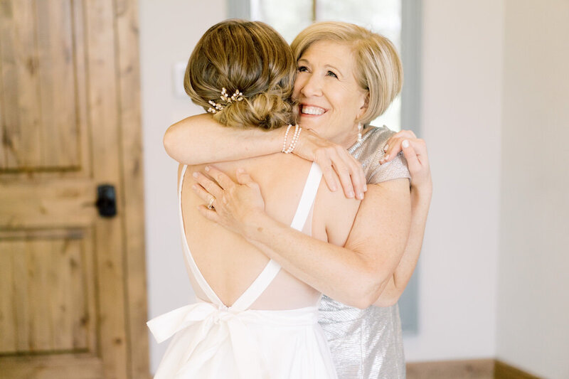 Bride getting ready in Canyonwood Ridge bridal suite with natural light and soft details