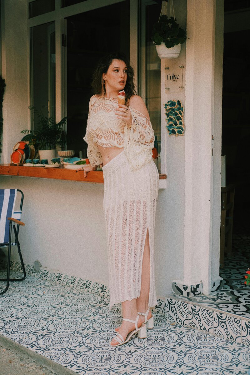 woman standing in boho lace outfit