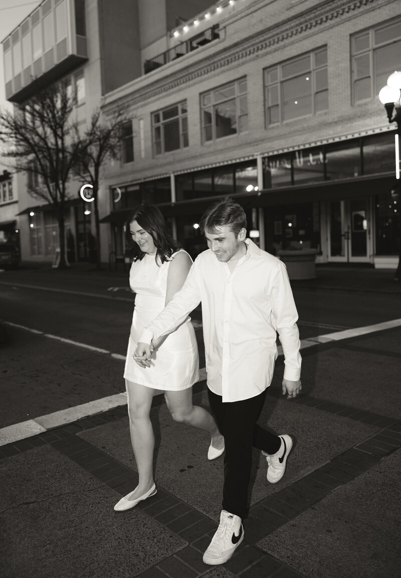 engaged couple walking in seattle