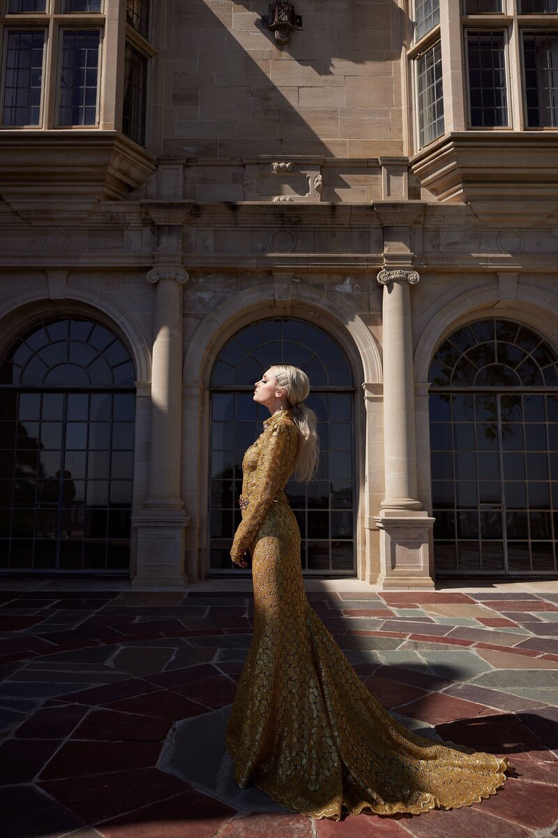 Editorial teen model with soft waves and natural makeup wearing a lacy, vintage-inspired gown—captured during a styled mentorship session in dreamy natural light.