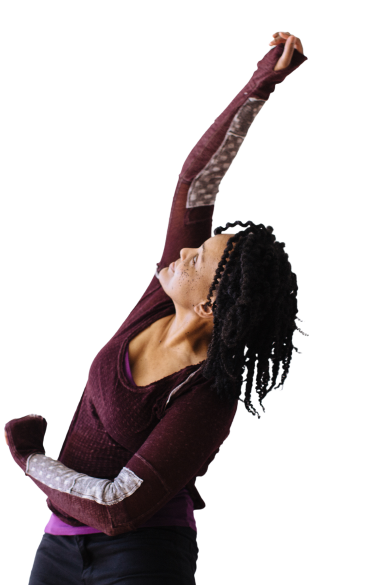 Jennifer Sterling, Dance/Movement Therapist, extending her arm upward in a powerful movement, embodying somatic healing and liberation for Strong Black Women.