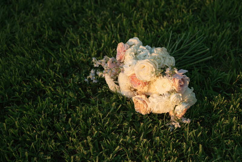 Bridal bouquet laying in the grass at Nashville wedding