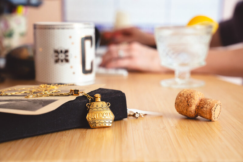 Photo of Cassie uncorking a potion and practicing a little alchemy - specifically launch alchemy - Mettle & Tonic