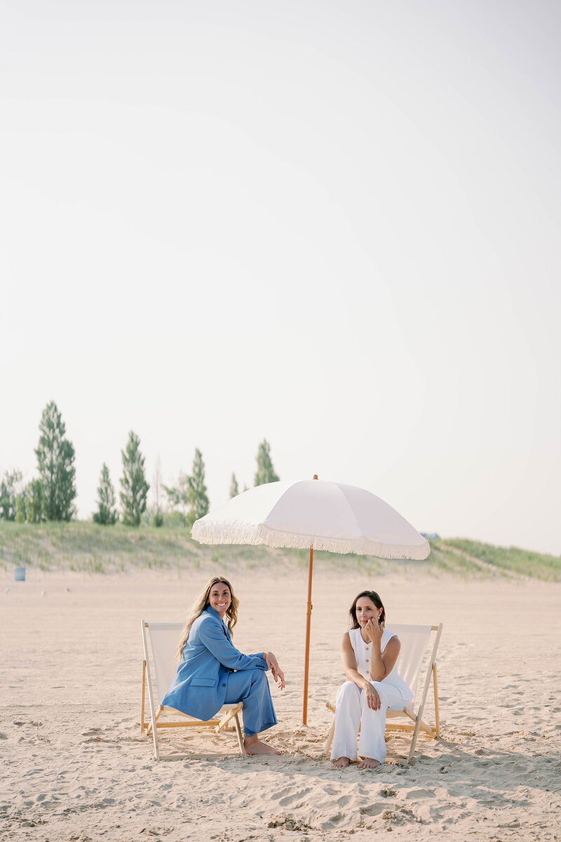 Social Media Agency Brand Photos, Two Women Sitting on Couch holding Newspaper, Creative Waves Studio, Social Media Managers, Social Media Strategists